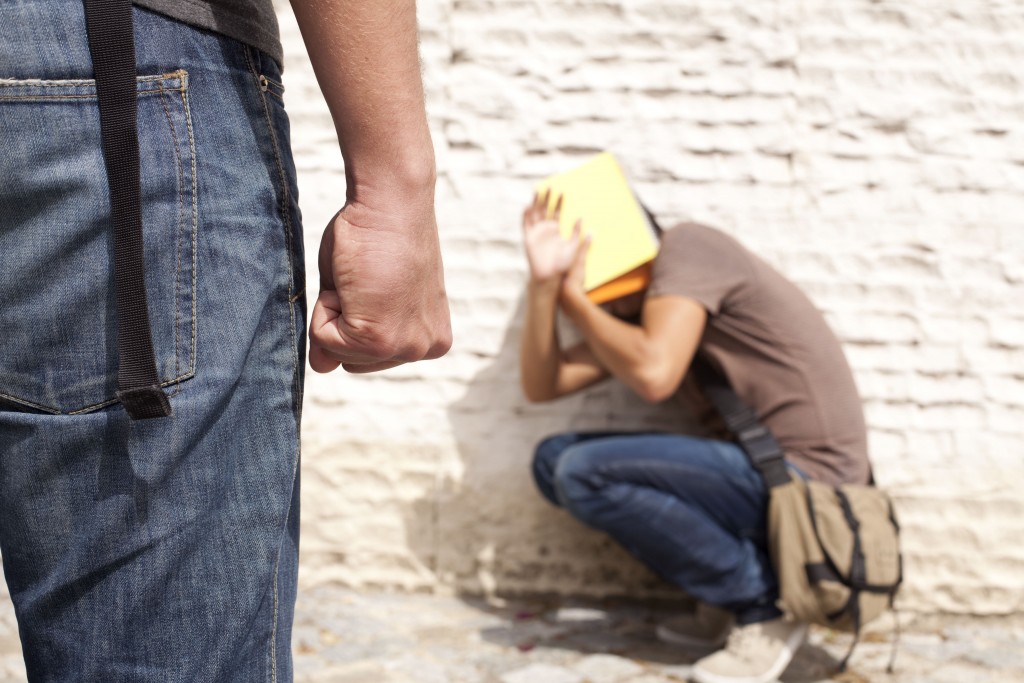 Teenager student with fear at his school (selective focus)