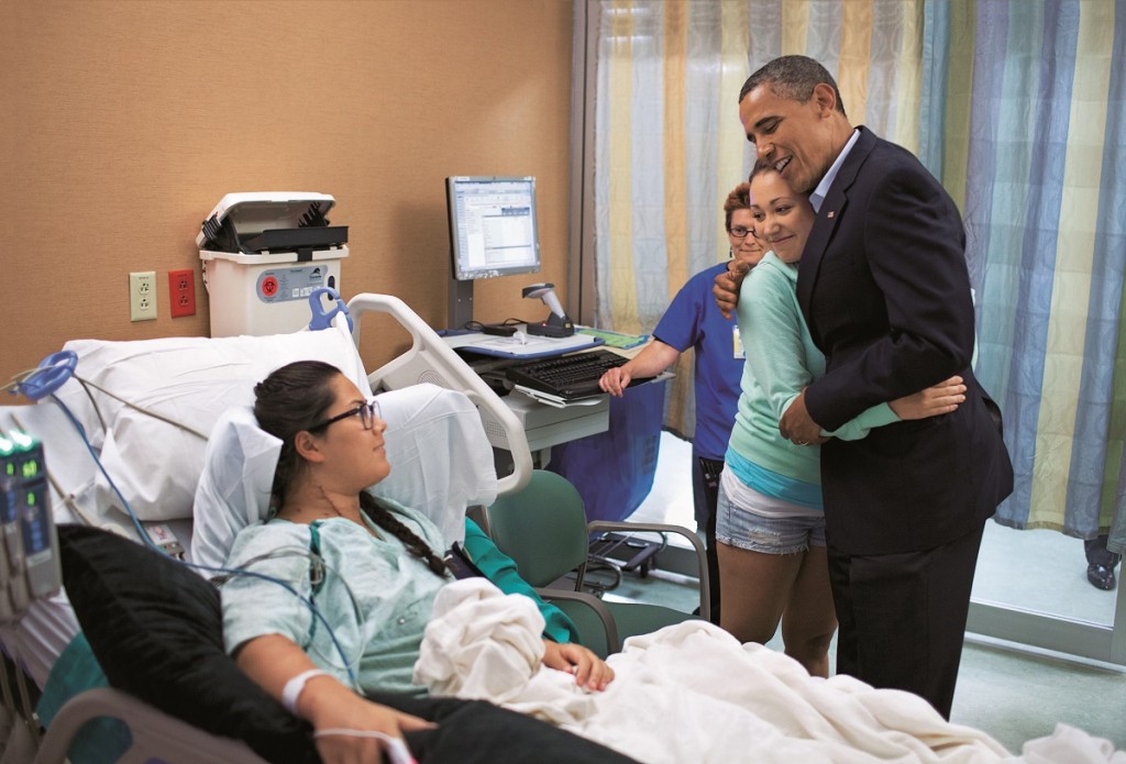 President Barack Obama hugs Stephanie Davies, who helped keep her friend Allie Young, left, alive after she was shot during the Colorado cinema massacre last week. The president visited patients and family members affected by the shootings at the University of Colorado Hospital. Colorado, USA - 22.07.12 **Only available for publication in the UK. Not available for the rest of the world ** Mandatory Credit: News Pictures/WENN.com