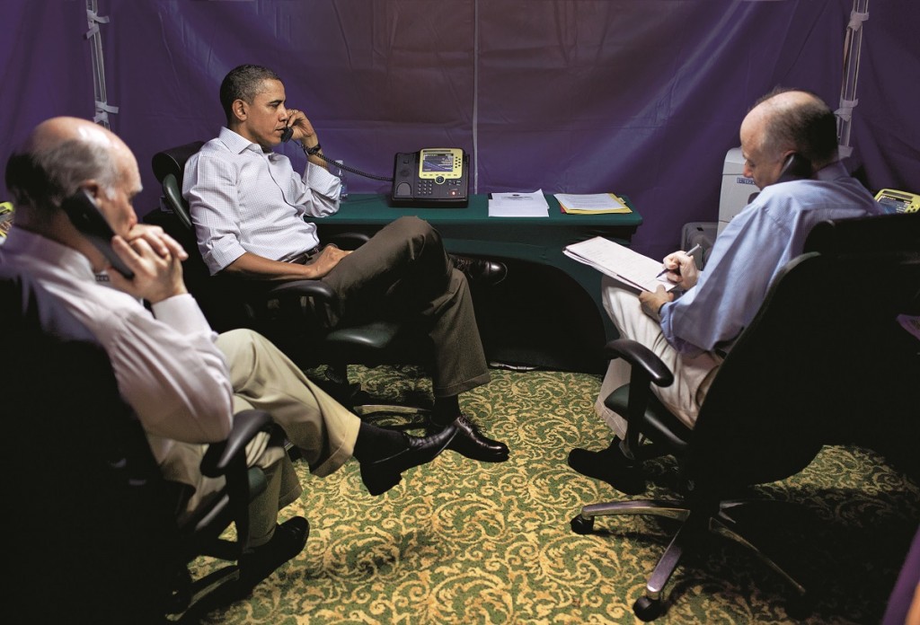 Caption supplied by the White House: ìPresident Barack Obama is briefed on the situation in Libya during a secure conference call with National Security Advisor Tom Donilon, right, Chief of Staff Bill Daley, left, Secretary of State Hillary Clinton, Secretary of Defense Bob Gates, AFRICOM Commander General Carter Ham, and Deputy National Security Advisor Denis McDonough, in Rio de Janeiro, Brazil, Sunday, March 20, 2011. (Official White House Photo by Pete Souza)î