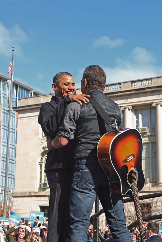 MADISON, WI - NOVEMBER 05: Rocker Bruce Springsteen (R) welcomes U.S. President Barack Obama to the stage during a rally on the last day of campaigning in the general election November 5, 2012 in Madison, Wisconsin. Obama and his opponent, Republican presidential nominee and former Massachusetts Gov. Mitt Romney are stumping from one 'swing state' to the next in a last-minute rush to persuade undecided voters. (Photo by Chip Somodevilla/Getty Images)