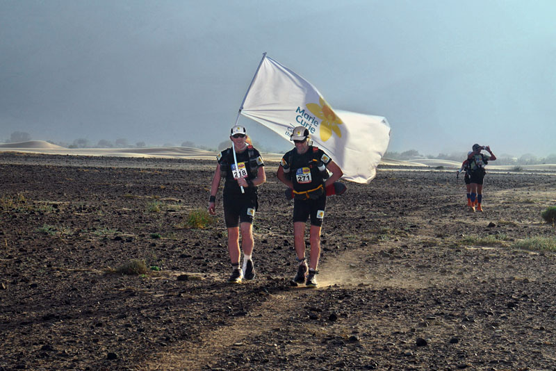 Handout photo issued by Marie Curie Cancer Care of Sir Ranulph Fiennes and trainer Rory Coleman approaching camp 4 during the fourth day for the Marathon des Sables - a gruelling six-day ultra-marathon in the Moroccan desert.